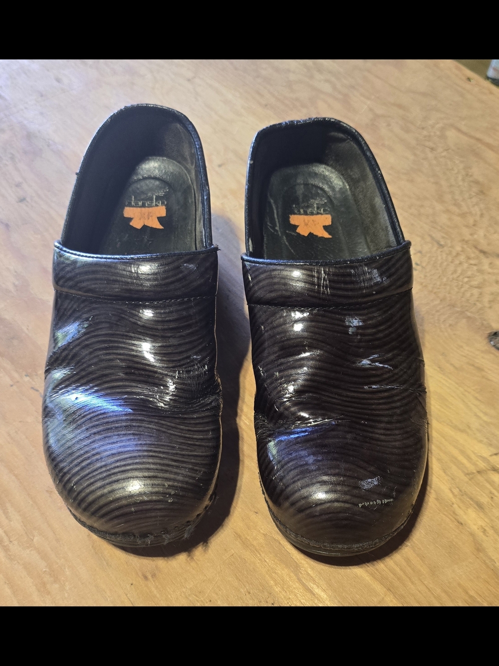 Dansko XP 2.0 Women's Black Patent Leather Wave-Textured Clogs